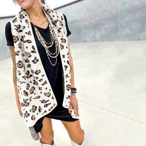 Francesca’s Leighton Ivory Leopard Print Fuzzy Sleeveless Sweater Vest